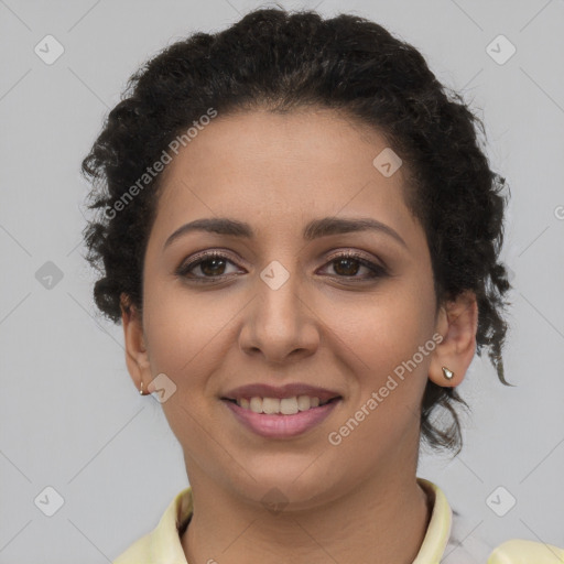 Joyful latino young-adult female with short  brown hair and brown eyes