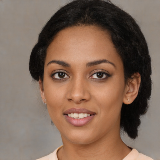 Joyful latino young-adult female with medium  black hair and brown eyes