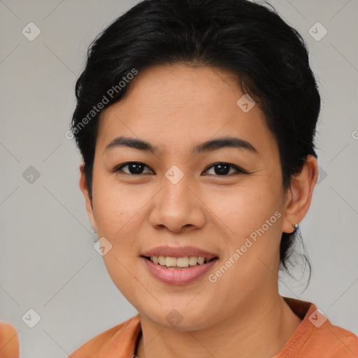 Joyful asian young-adult female with short  brown hair and brown eyes