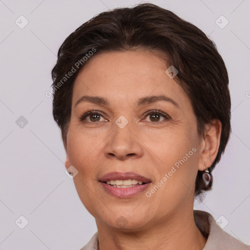 Joyful white adult female with medium  brown hair and brown eyes