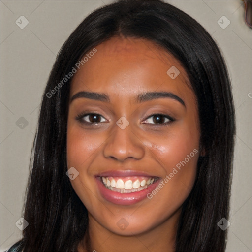 Joyful latino young-adult female with long  black hair and brown eyes