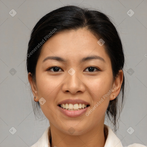 Joyful asian young-adult female with medium  brown hair and brown eyes