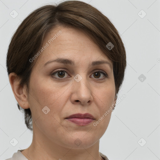 Joyful white adult female with short  brown hair and grey eyes