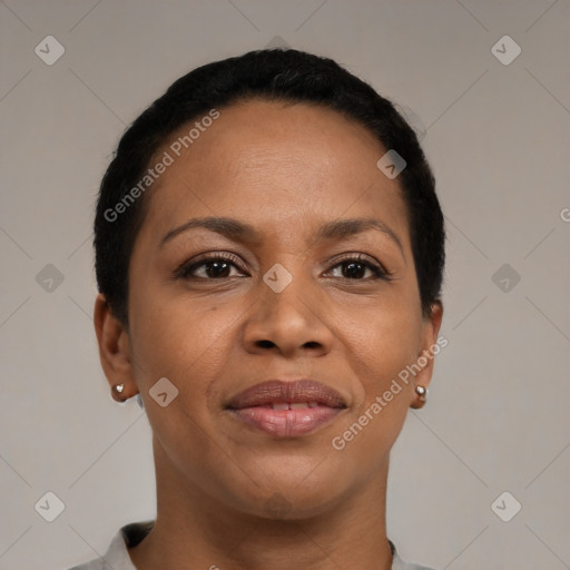 Joyful black adult female with short  black hair and brown eyes