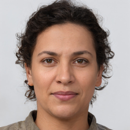 Joyful white adult female with short  brown hair and brown eyes
