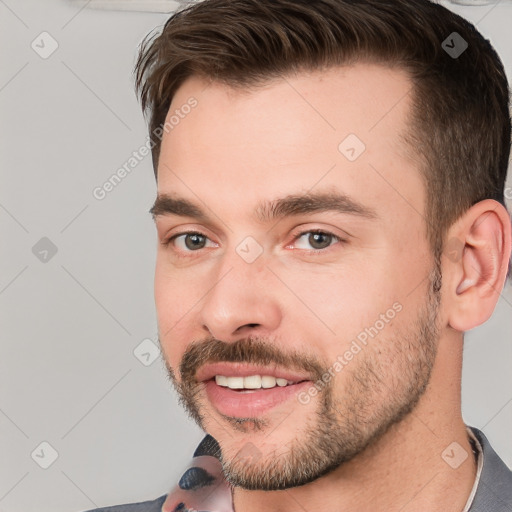 Joyful white young-adult male with short  brown hair and brown eyes