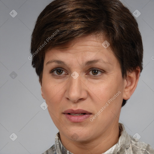 Joyful white adult female with short  brown hair and grey eyes