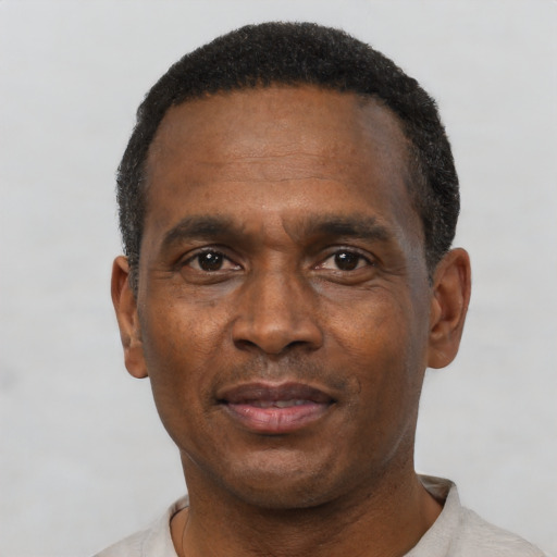 Neutral black adult male with short  black hair and brown eyes