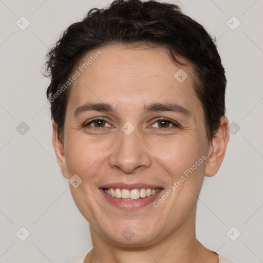 Joyful white adult female with short  brown hair and brown eyes