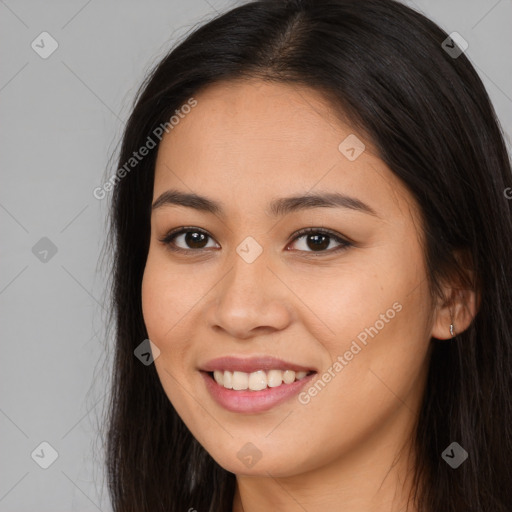 Joyful latino young-adult female with long  brown hair and brown eyes