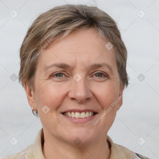 Joyful white adult female with short  brown hair and grey eyes