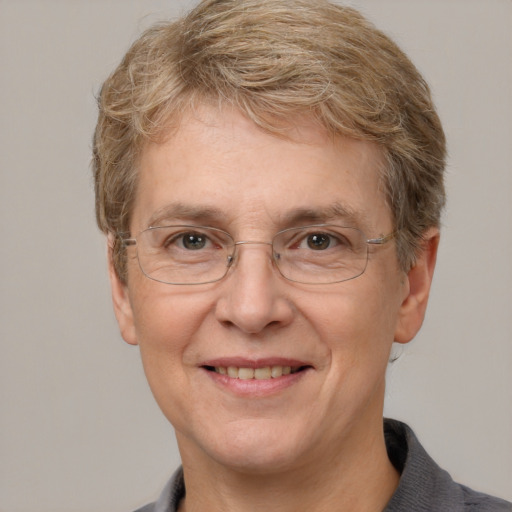 Joyful white middle-aged female with short  brown hair and grey eyes