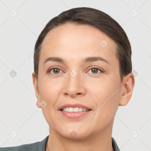 Joyful white young-adult female with short  brown hair and brown eyes