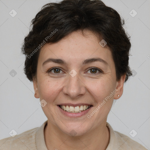 Joyful white adult female with short  brown hair and brown eyes