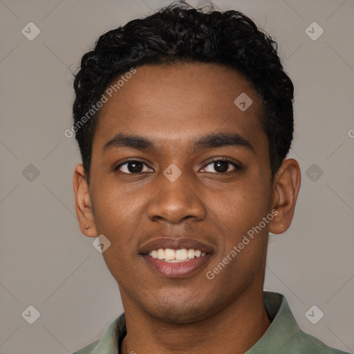 Joyful black young-adult male with short  black hair and brown eyes