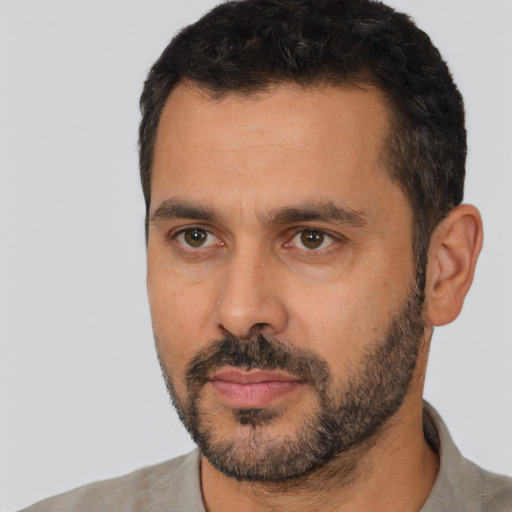 Neutral white adult male with short  black hair and brown eyes
