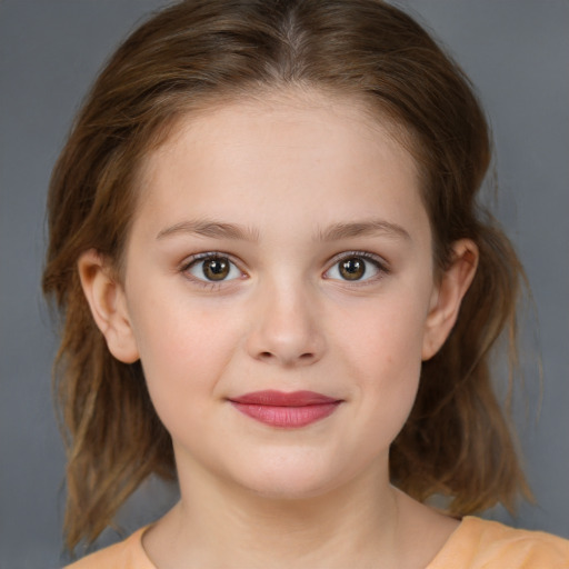 Joyful white child female with medium  brown hair and brown eyes