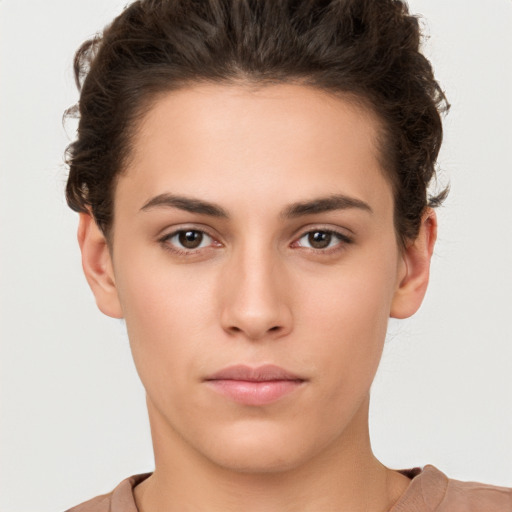 Neutral white young-adult female with short  brown hair and brown eyes