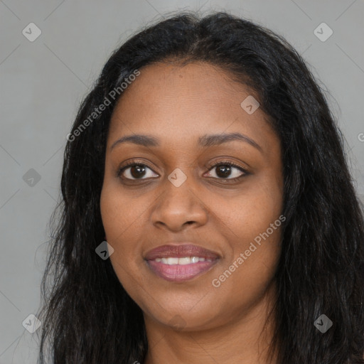 Joyful black young-adult female with long  black hair and brown eyes