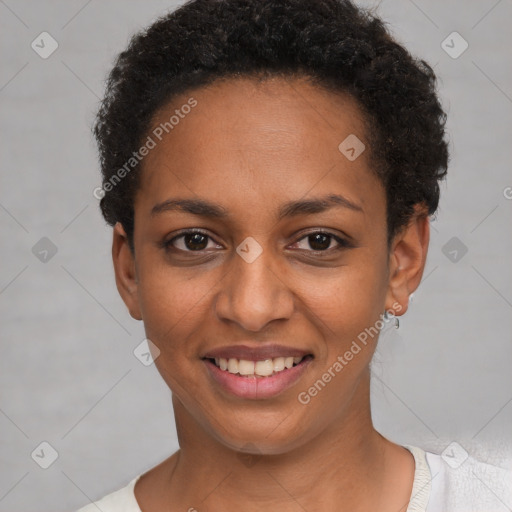 Joyful black young-adult female with short  black hair and brown eyes