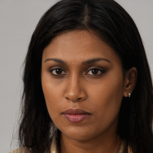 Neutral black young-adult female with long  brown hair and brown eyes