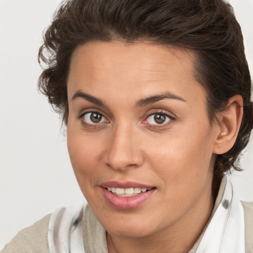 Joyful white young-adult female with medium  brown hair and brown eyes