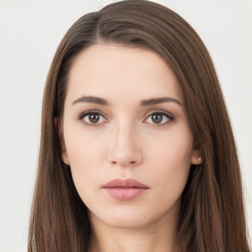 Neutral white young-adult female with long  brown hair and brown eyes