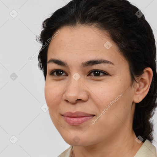 Joyful latino young-adult female with medium  brown hair and brown eyes