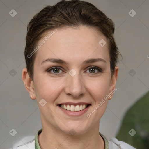 Joyful white adult female with short  brown hair and grey eyes