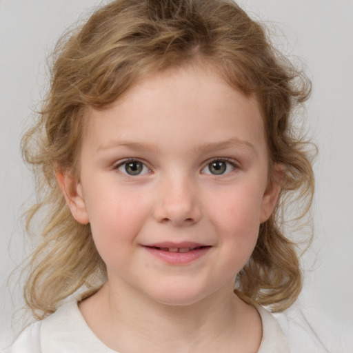 Joyful white child female with medium  brown hair and blue eyes