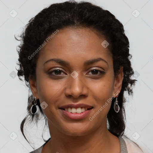 Joyful black young-adult female with long  brown hair and brown eyes