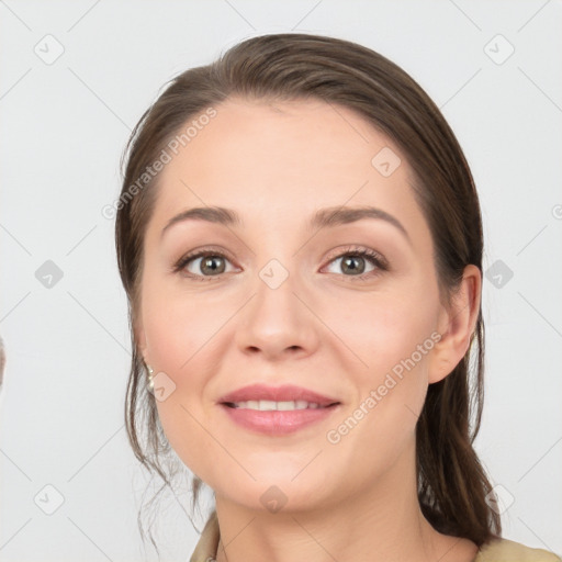 Joyful white young-adult female with long  brown hair and grey eyes