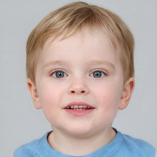 Joyful white child male with short  brown hair and blue eyes