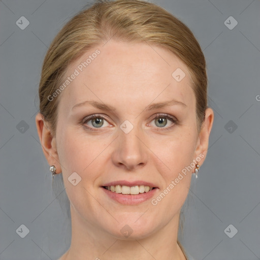 Joyful white adult female with medium  brown hair and blue eyes