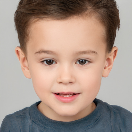 Joyful white child male with short  brown hair and brown eyes