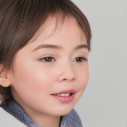 Joyful white child female with short  brown hair and brown eyes