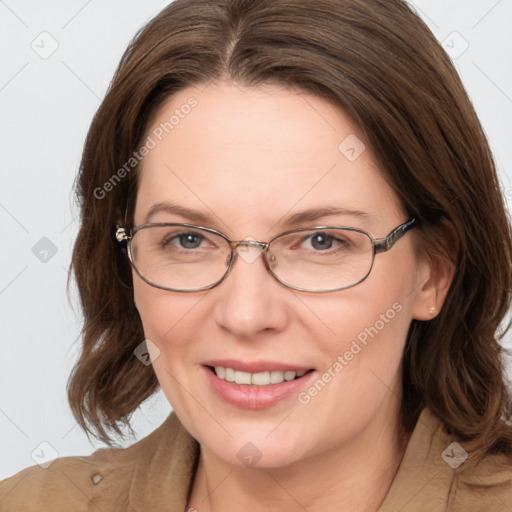 Joyful white adult female with medium  brown hair and blue eyes