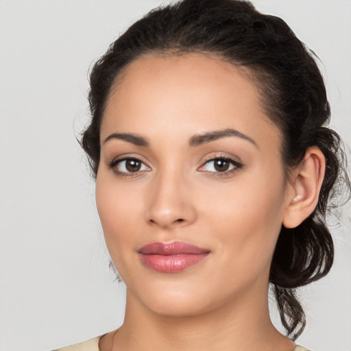 Joyful white young-adult female with medium  black hair and brown eyes