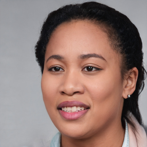 Joyful black young-adult female with medium  black hair and brown eyes