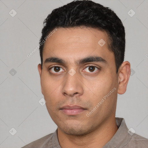 Neutral latino young-adult male with short  black hair and brown eyes