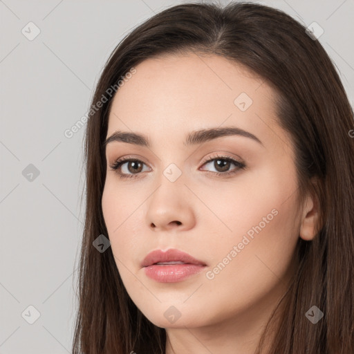 Neutral white young-adult female with long  brown hair and brown eyes