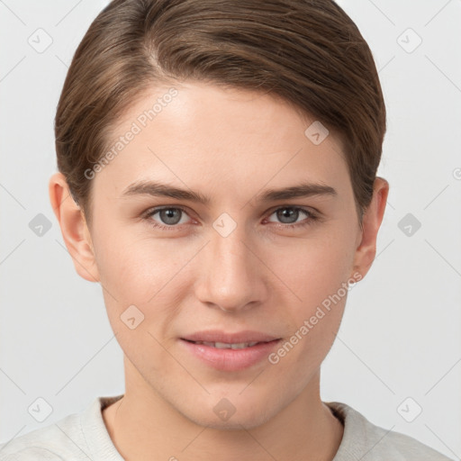 Joyful white young-adult female with short  brown hair and grey eyes