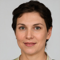 Joyful white adult female with short  brown hair and grey eyes