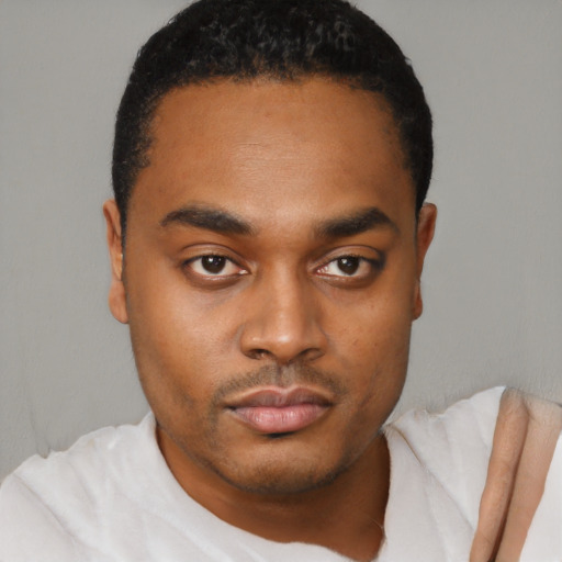 Neutral black young-adult male with short  black hair and brown eyes