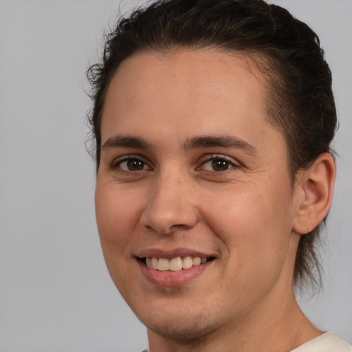 Joyful white young-adult male with medium  brown hair and brown eyes