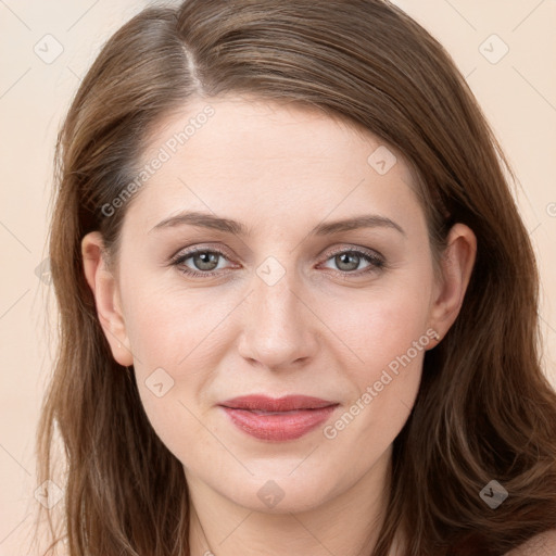 Joyful white young-adult female with long  brown hair and grey eyes