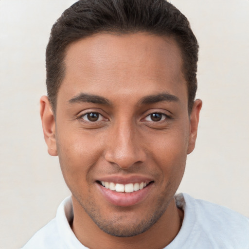 Joyful white young-adult male with short  brown hair and brown eyes