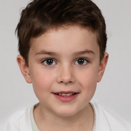 Joyful white child male with short  brown hair and brown eyes