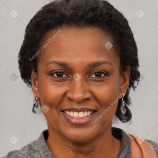 Joyful black adult female with short  brown hair and brown eyes