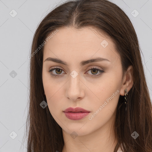 Neutral white young-adult female with long  brown hair and brown eyes